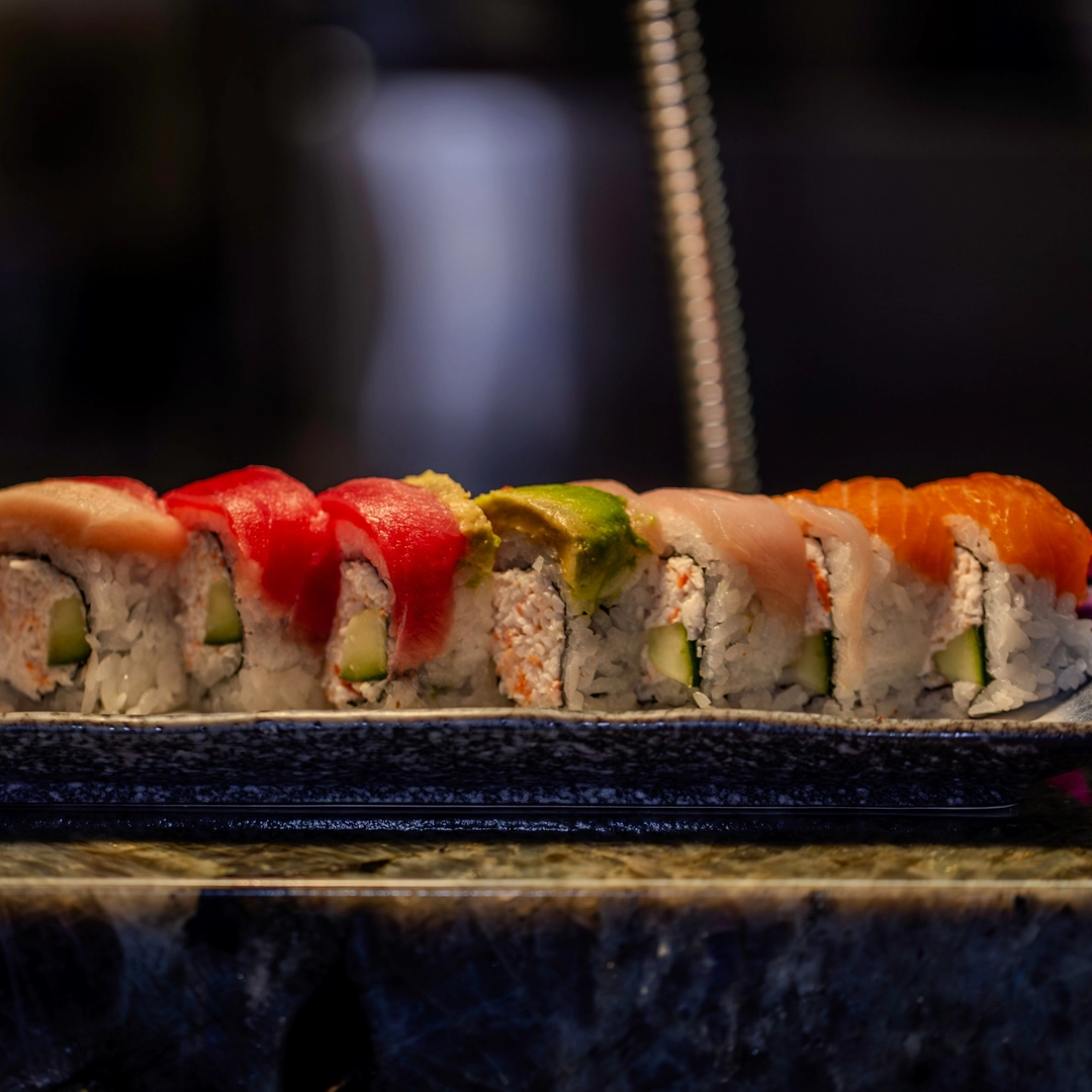 Colorful rainbow roll sushi with fresh avocado and fish at Las Vegas Japanese restaurant
